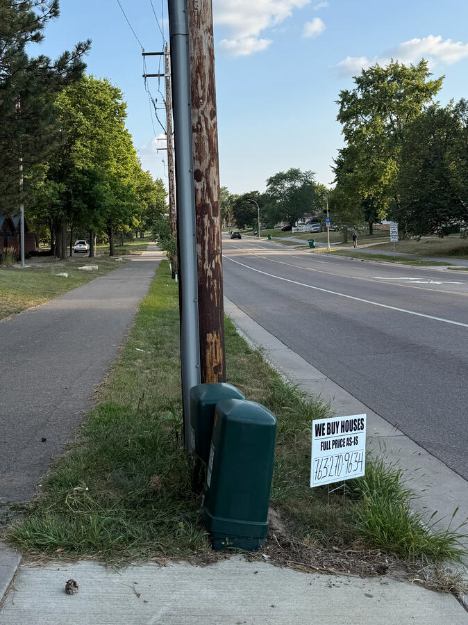 Advertising sign on a street corner