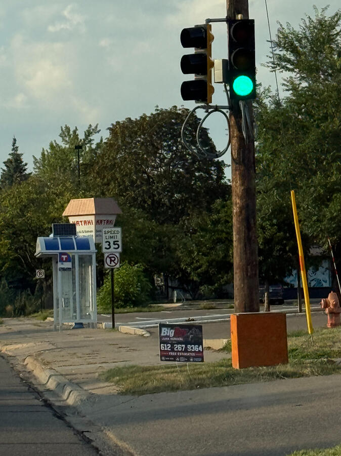 64th and Nicollet Advertising sign on a street corner